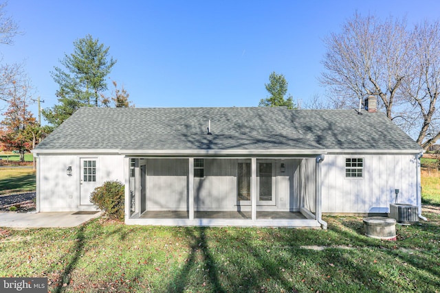 back of house with a patio, a sunroom, central AC, and a yard