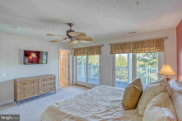 bedroom featuring ceiling fan, light carpet, and access to outside