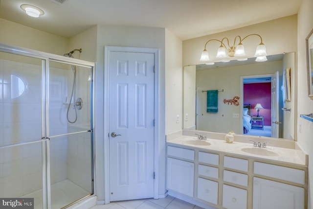 bathroom with walk in shower, vanity, and tile patterned flooring