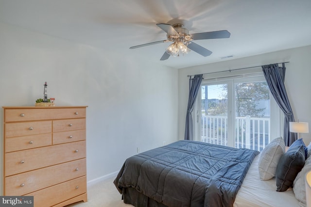 bedroom featuring ceiling fan and light carpet