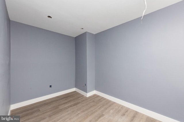 empty room with light hardwood / wood-style floors