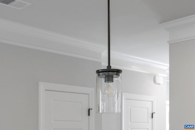 interior details featuring an inviting chandelier