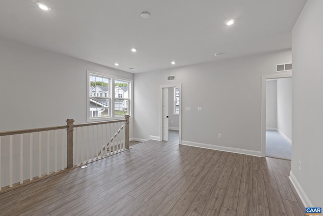 unfurnished room with light hardwood / wood-style floors