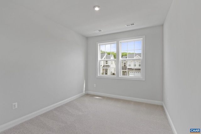 unfurnished room with carpet floors