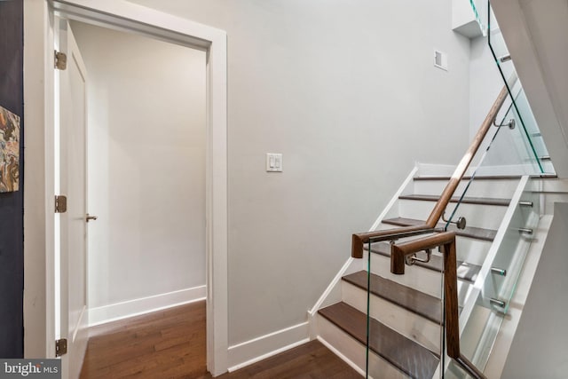 stairs featuring wood-type flooring