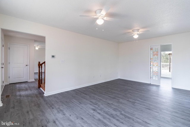 unfurnished room featuring a textured ceiling, ceiling fan, and dark hardwood / wood-style floors