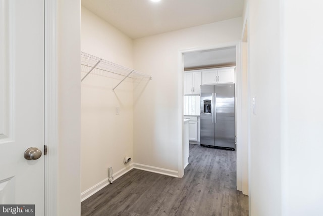 laundry area with hardwood / wood-style flooring