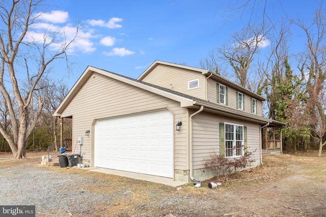 view of side of home featuring a garage