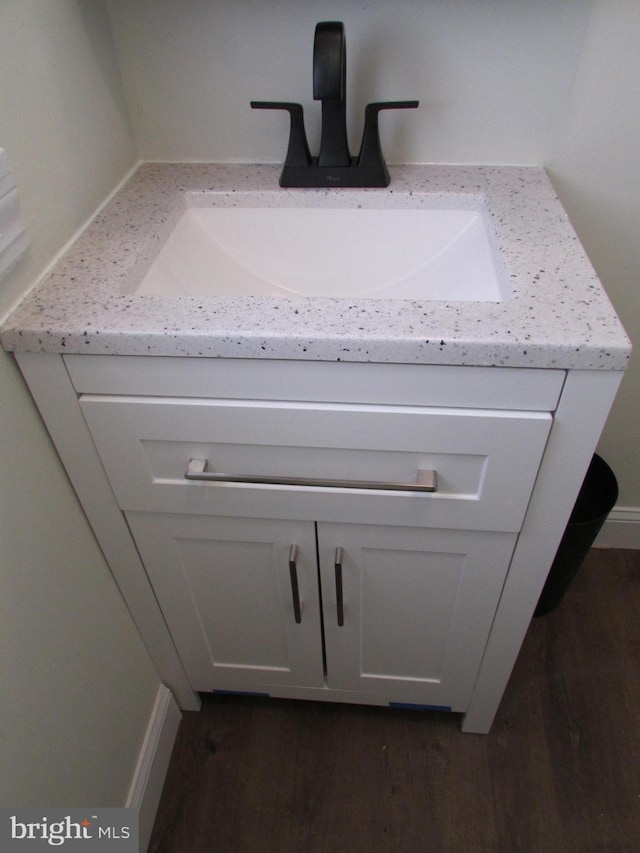 room details with wood-type flooring and vanity