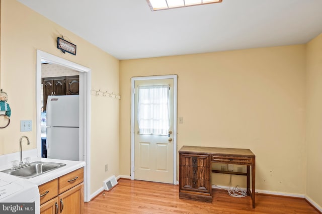 interior space featuring light hardwood / wood-style floors and sink