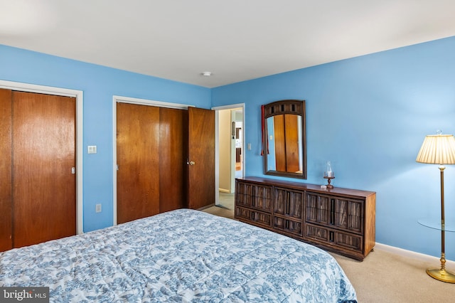 carpeted bedroom featuring a closet