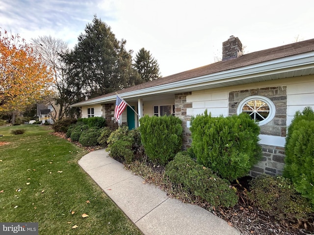 ranch-style home with a front yard