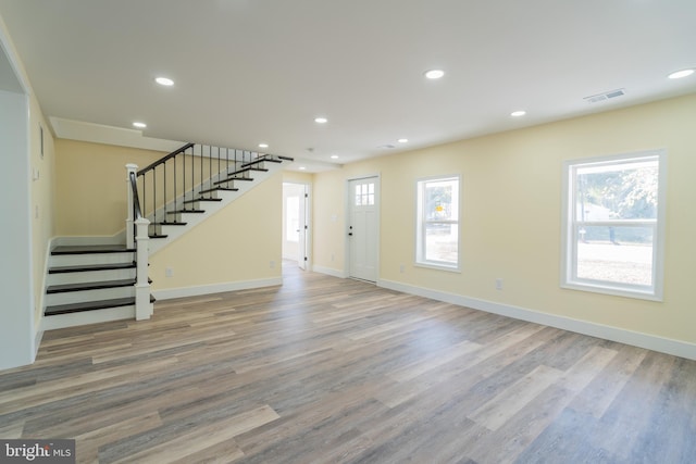 unfurnished living room featuring hardwood / wood-style floors