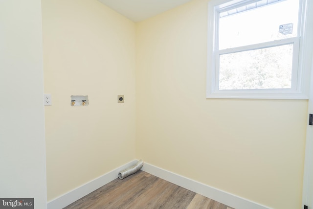 laundry room featuring light hardwood / wood-style floors, hookup for a washing machine, and electric dryer hookup