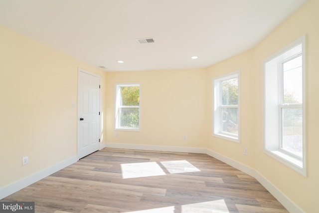 empty room with light hardwood / wood-style floors