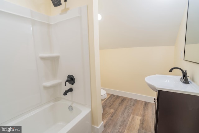 full bathroom with toilet, vanity, shower / bathtub combination, and wood-type flooring