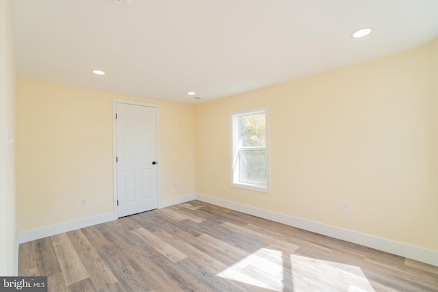 spare room with light wood-type flooring