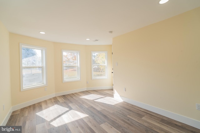 spare room with light hardwood / wood-style flooring