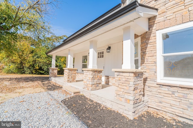 view of exterior entry with covered porch