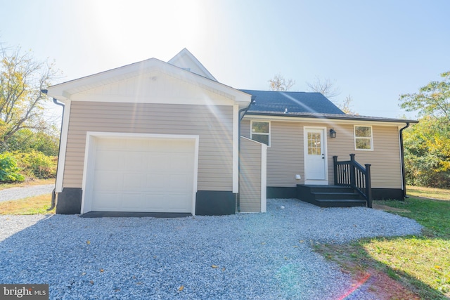 single story home with a garage