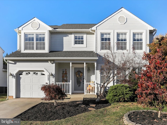 front of property with a garage and a porch