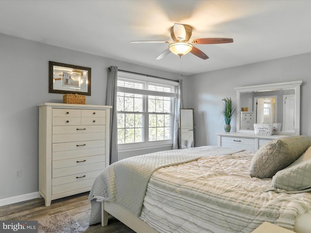 bedroom featuring hardwood / wood-style floors and ceiling fan