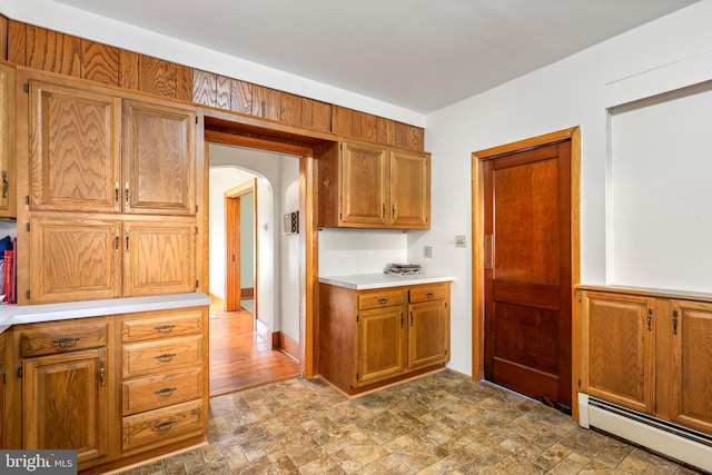 kitchen with a baseboard heating unit