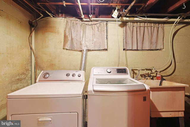 laundry room featuring washer and dryer and sink