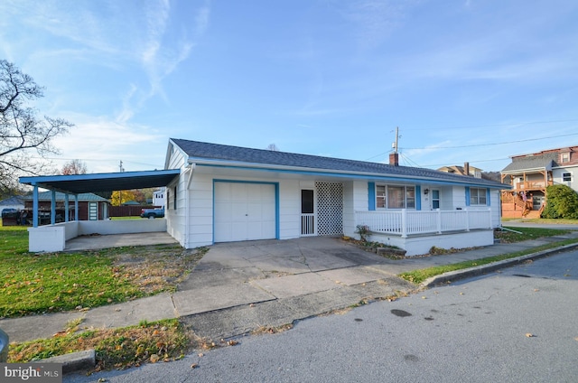 single story home with a garage, a carport, and a porch