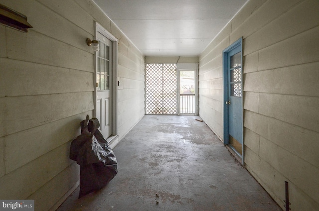 hallway with concrete flooring