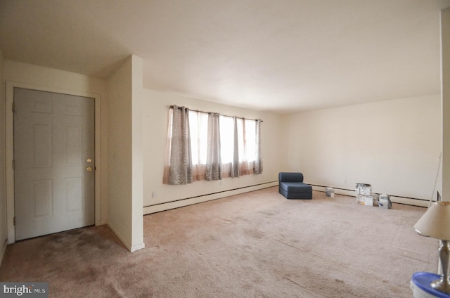 unfurnished room with carpet and baseboard heating