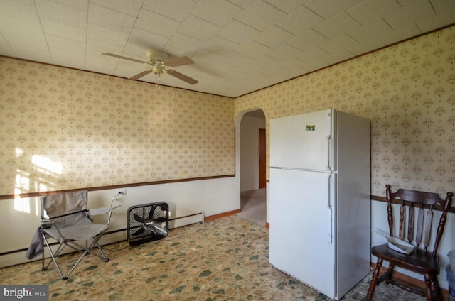 kitchen with ceiling fan and white fridge