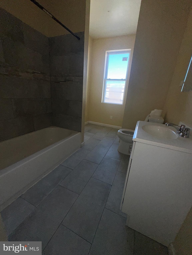 full bathroom with tile patterned flooring, vanity, toilet, and tiled shower / bath combo