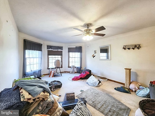 carpeted living room featuring ceiling fan