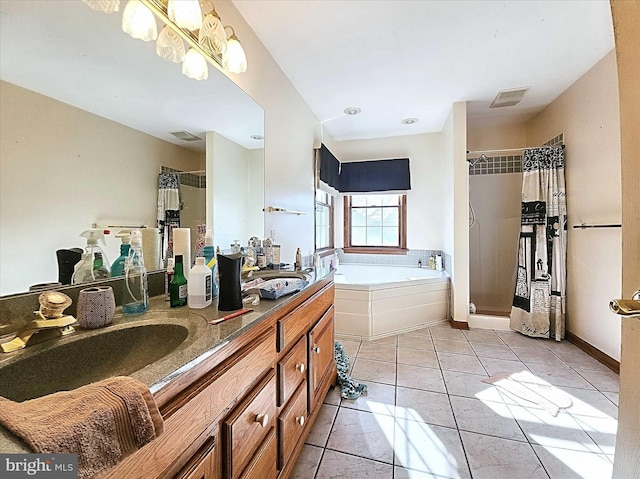 bathroom featuring tile patterned flooring, vanity, and plus walk in shower