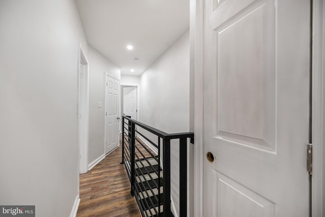 hall with dark wood-type flooring