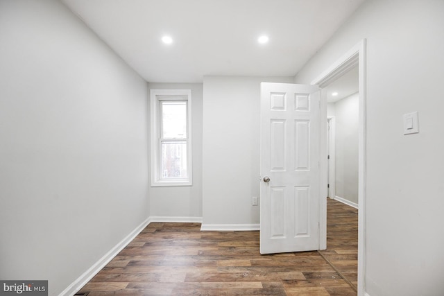 spare room featuring dark hardwood / wood-style floors