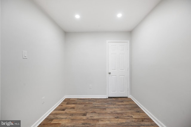 spare room with dark hardwood / wood-style floors