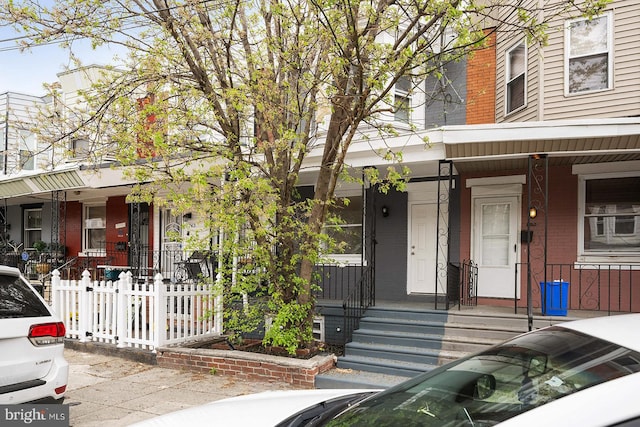 view of property with covered porch