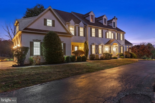 view of front of home featuring a lawn