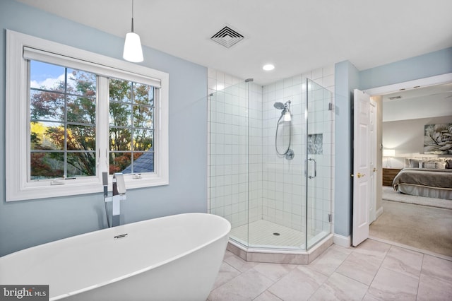 bathroom with separate shower and tub