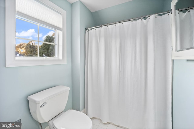 bathroom featuring tile patterned floors and toilet