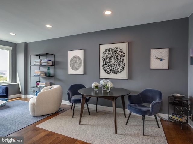 home office with hardwood / wood-style floors