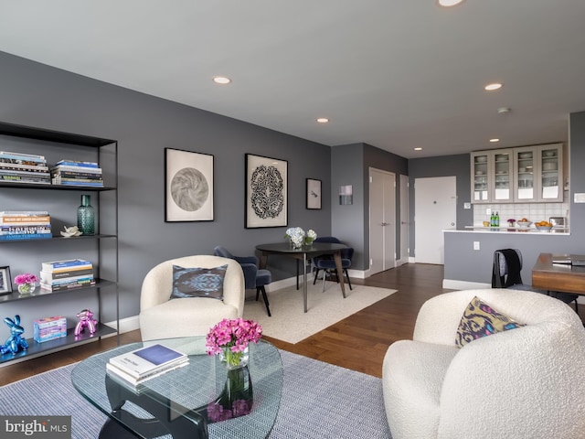 living room with dark hardwood / wood-style floors