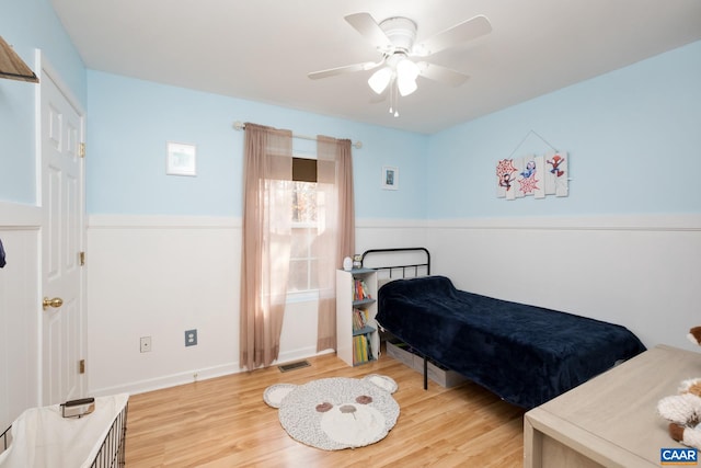 bedroom with light wood-type flooring and ceiling fan