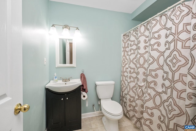 bathroom with vanity, tile patterned floors, and toilet