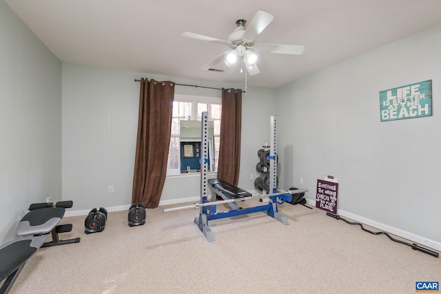 workout room featuring ceiling fan and carpet floors