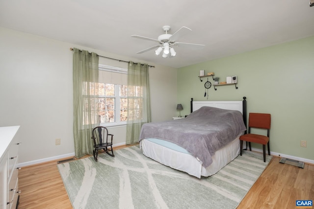 bedroom with ceiling fan and light hardwood / wood-style flooring