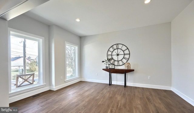 entrance foyer featuring baseboards, dark wood-style floors, and recessed lighting