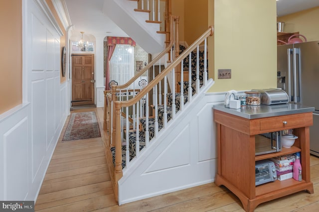 staircase featuring wood-type flooring